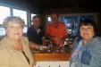 Sisters Mary & Pat from  Cape May,  NJ, being served by Travis & Ron  at Fager’s Island. photo by Frank DelPiano